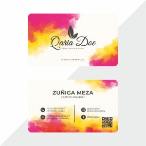 Sleek metallic visiting card with engraved text and modern design on a dark surface